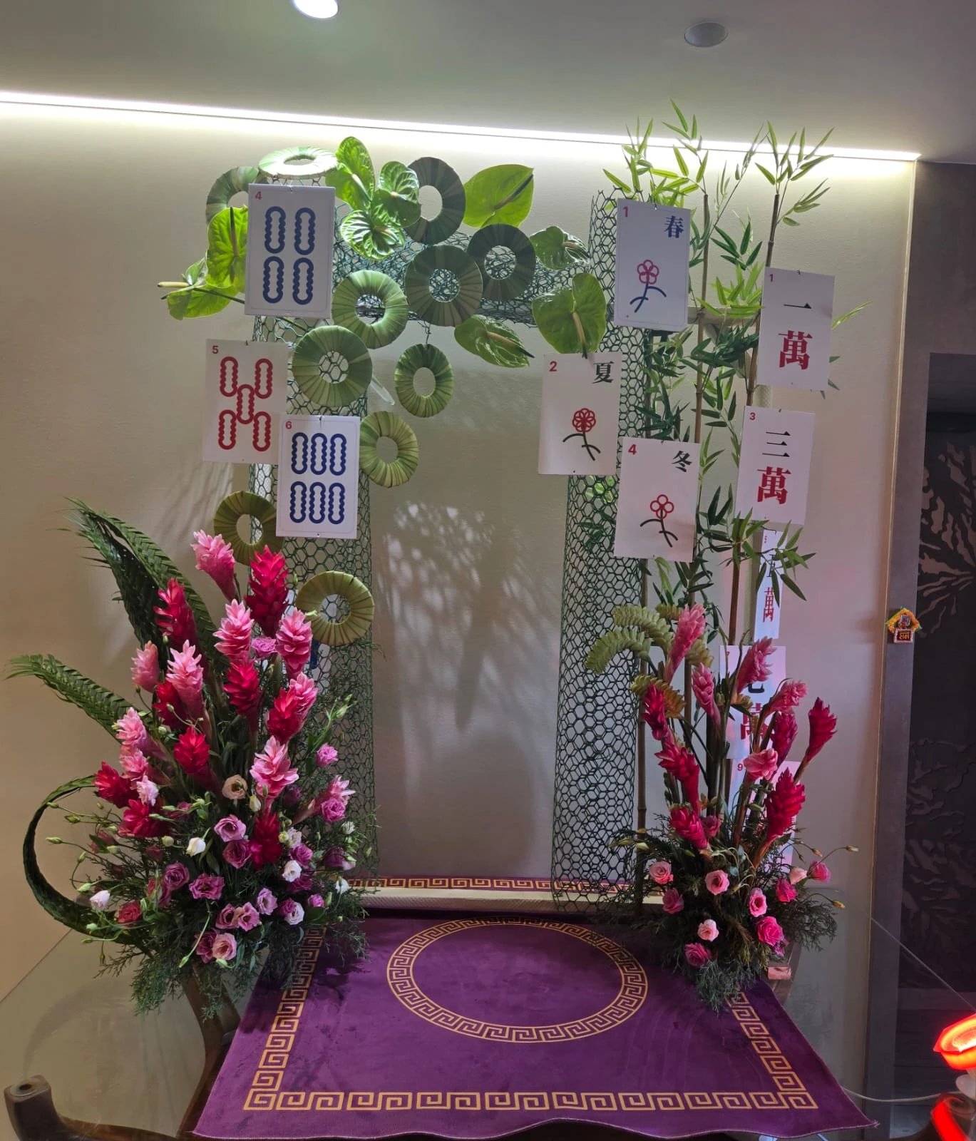 The full mahjong-themed mandap setting seen from the front